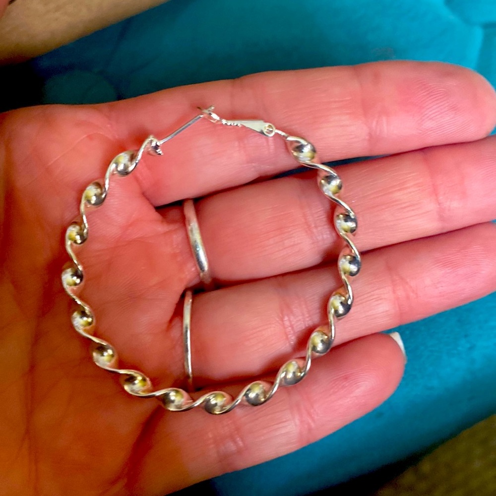 Large twisted 925 silver earrings.